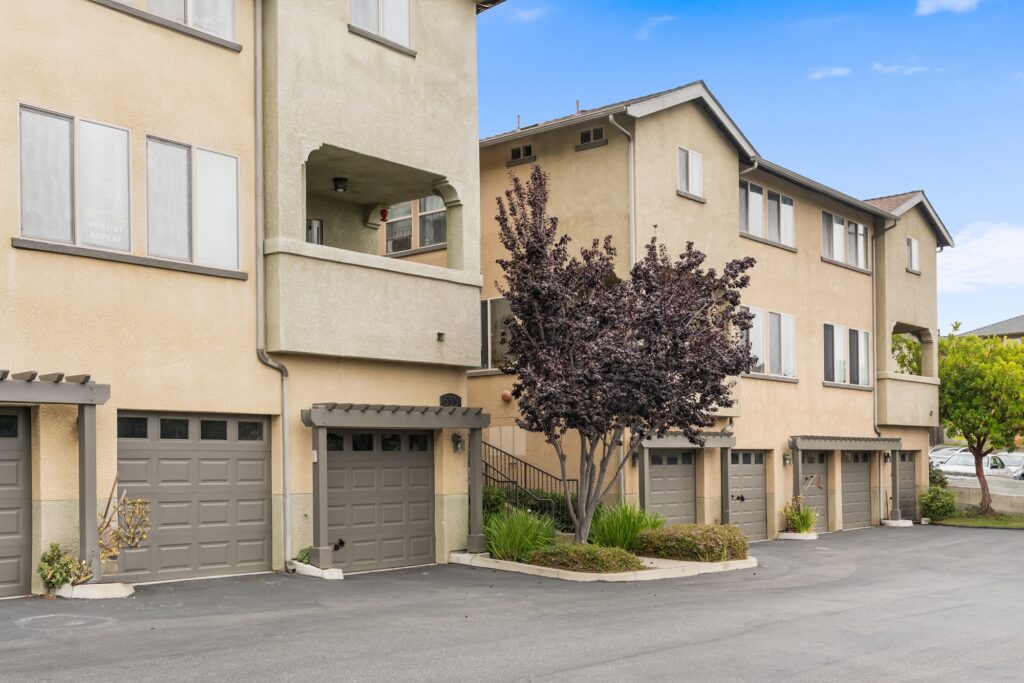 Exterior view of multi-level townhome with garages at 545 Paseo Bella Montana.